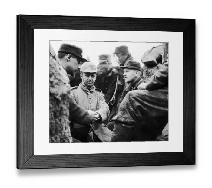 Framed Print : A German soldier captured by the Belgian troops is given medical treatment to an injured