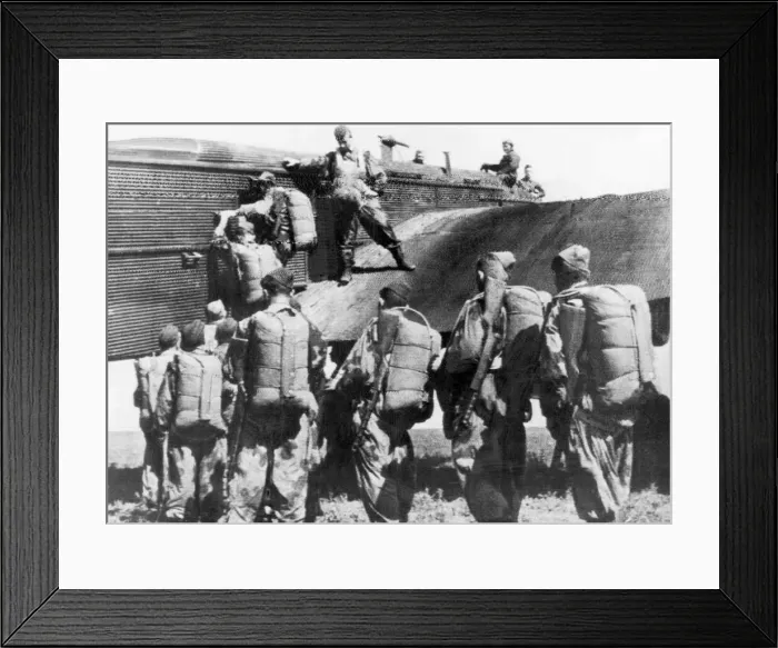 Framed Print : A group of Soviet parachutists boarding a plane during drills before joining guerillas Framed Print : A group of Soviet parachutists boarding a plane during drills before joining guerillas