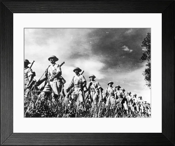 Framed Print : troops of a famous Indian regiment advancing in column through countryside in Malaya Framed Print : troops of a famous Indian regiment advancing in column through countryside in Malaya