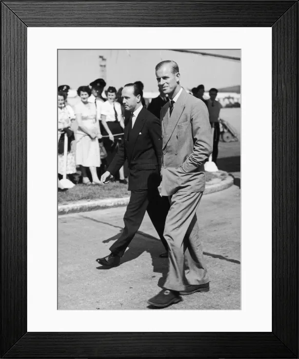 Framed Print : The Duke of Edinburgh arrives home on leave. Pictured with his private secretary Mike