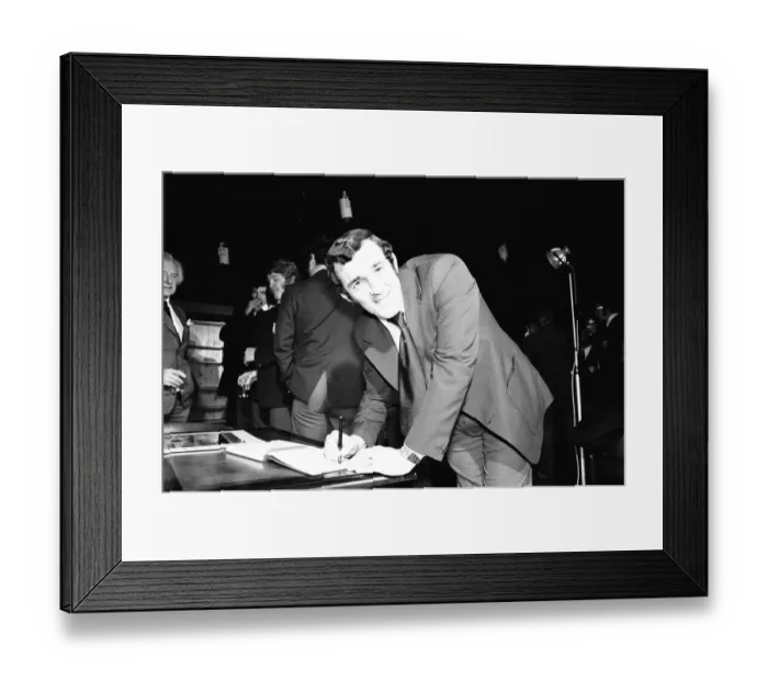 Framed Print : Phil Bennett signing the visitors book at the International Sports Writers Club in Great Framed Print : Phil Bennett signing the visitors book at the International Sports Writers Club in Great
