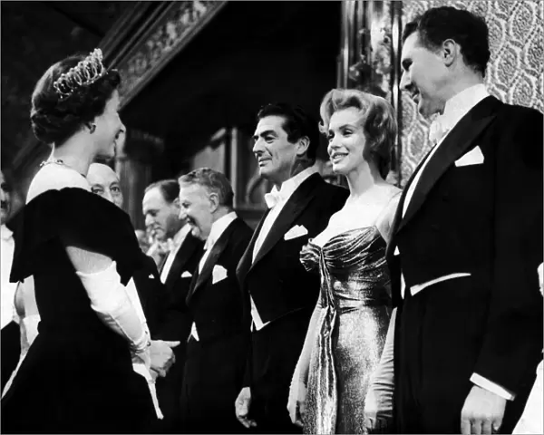 American film actress Marilyn Monroe meets Queen Elizabeth II at the Royal Command Film