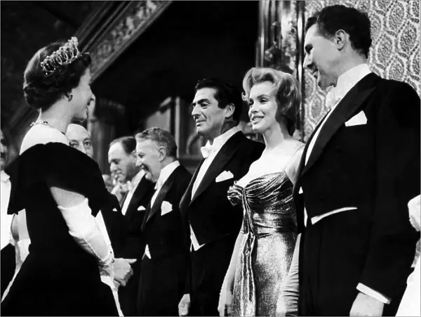 American film actress Marilyn Monroe meets Queen Elizabeth II at the Royal Command Film