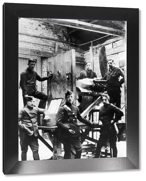 Warrant Officer Tom Guttery (centre) seen here in the test house of his workshop at an