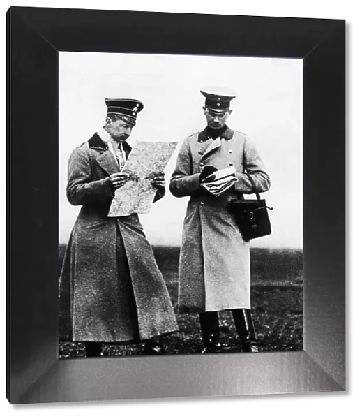 Crown Prince of Germany (left) seen here studying a map with one of his officer during