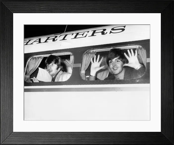 Framed Print : Beatle members Ringo Starr (left) and Paul McCartney look out of the window of plane Framed Print : Beatle members Ringo Starr (left) and Paul McCartney look out of the window of plane