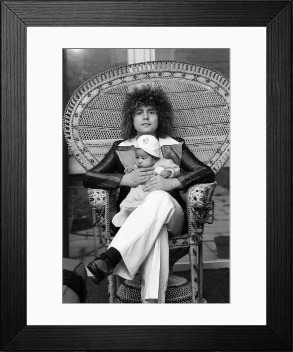 Framed Print : Marc Bolan with girlfriend Gloria Jones and their baby son Framed Print : Marc Bolan with girlfriend Gloria Jones and their baby son