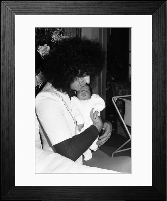 Framed Print : Marc Bolan with girlfriend Gloria Jones and their baby son Framed Print : Marc Bolan with girlfriend Gloria Jones and their baby son