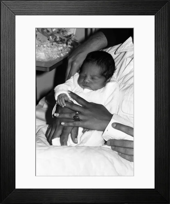 Framed Print : Marc Bolan with girlfriend Gloria Jones and their baby son Framed Print : Marc Bolan with girlfriend Gloria Jones and their baby son