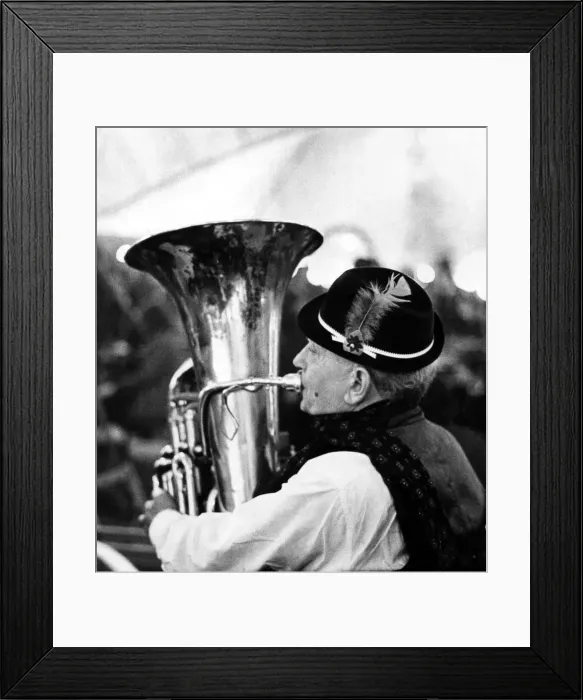 Framed Print : North East Festivals Playing away to keep himself warm is a member of the German