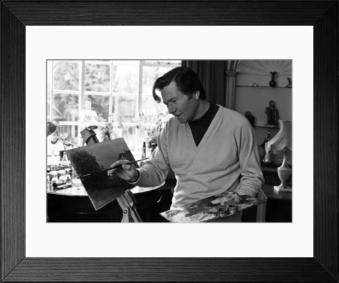 Framed Print : Reg Varney, actor and painter, touches up his latest work, at home in Enfield