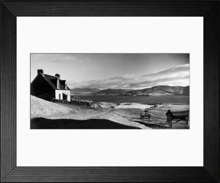 Framed Print : A traditional stone built cottage on the shore of Loch Tuath