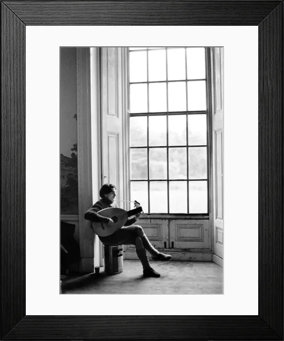 Framed Print : A lute player rehearses during a break in filming of Peter Halls Framed Print : A lute player rehearses during a break in filming of Peter Halls