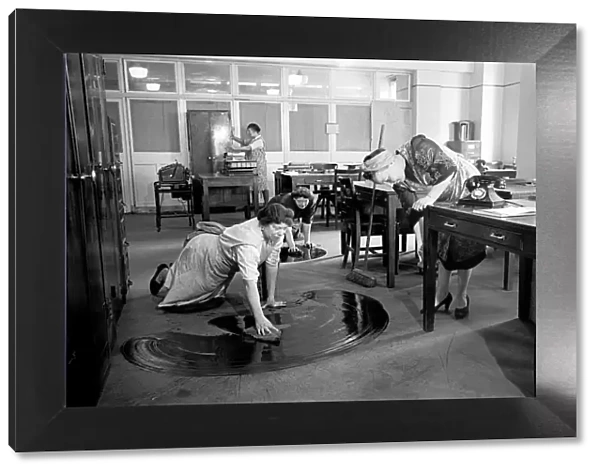 Charladies seen here cleaning the offices of city bankers whilst the square mile sleeps