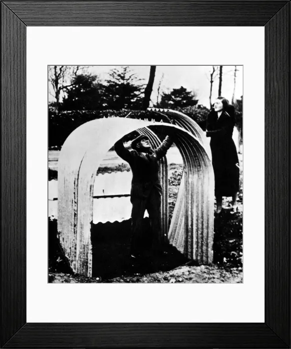 Framed Print : An Anderson air raid shelter under construction in a garden. Circa: 1939 Framed Print : An Anderson air raid shelter under construction in a garden. Circa: 1939