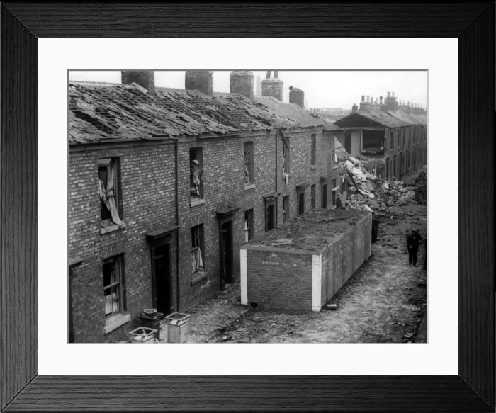 Framed Print : The surface street air raid shelters stand intact following a German raid on the North Framed Print : The surface street air raid shelters stand intact following a German raid on the North