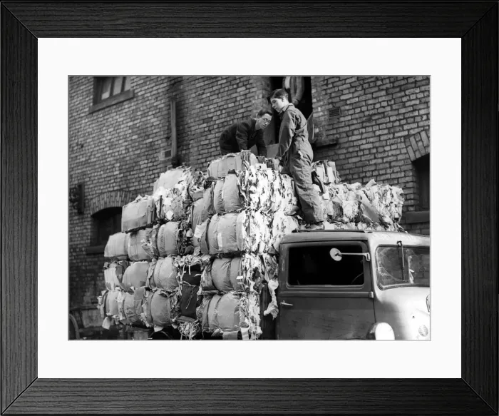 Framed Print : Workers load a lorry with 50 bales of salvaged paper weighing three tons at Newcastle Framed Print : Workers load a lorry with 50 bales of salvaged paper weighing three tons at Newcastle