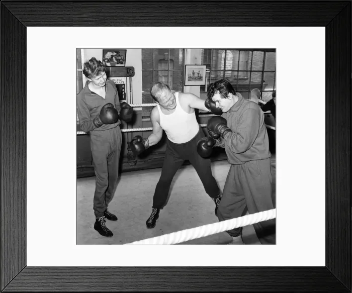 Framed Print : Roger Moore The Saint and Nosher Powell, sparring together Framed Print : Roger Moore The Saint and Nosher Powell, sparring together