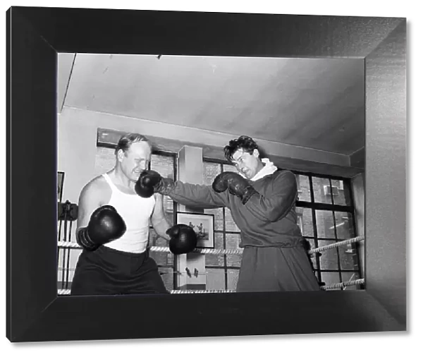 Roger Moore The Saint and Nosher Powell, sparring together
