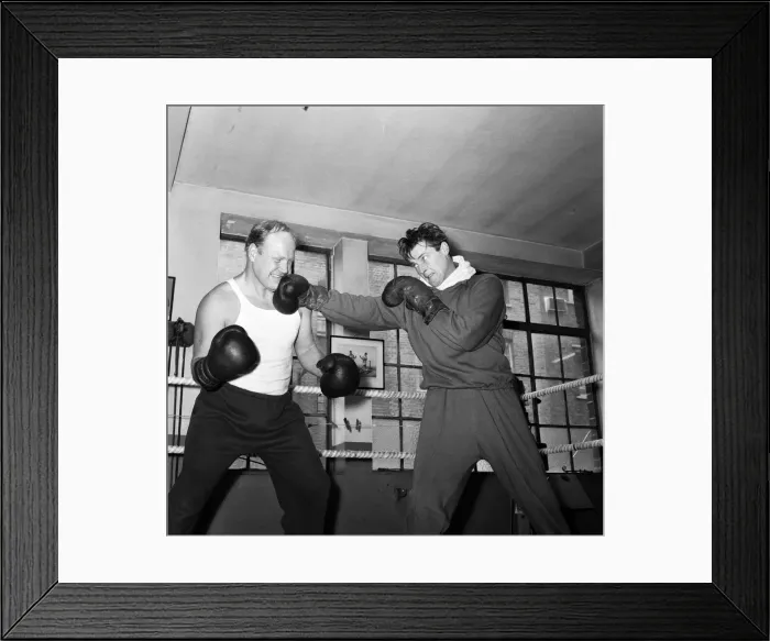Framed Print : Roger Moore The Saint and Nosher Powell, sparring together Framed Print : Roger Moore The Saint and Nosher Powell, sparring together