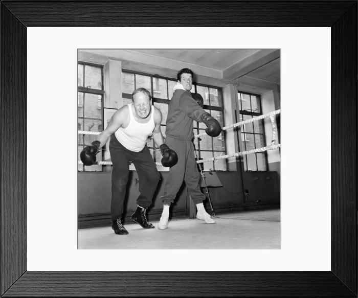 Framed Print : Roger Moore The Saint and Nosher Powell, sparring together Framed Print : Roger Moore The Saint and Nosher Powell, sparring together
