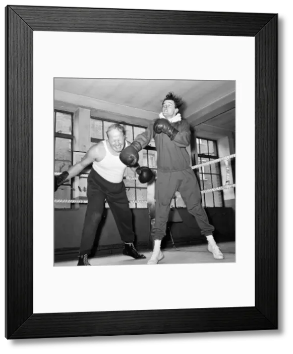 Framed Print : Roger Moore The Saint and Nosher Powell, sparring together Framed Print : Roger Moore The Saint and Nosher Powell, sparring together