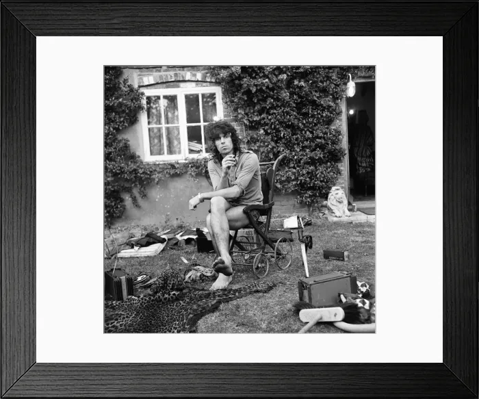 Framed Print : A dazed looking Keith Richards of The Rolling Stones sits outside his Redlands home Framed Print : A dazed looking Keith Richards of The Rolling Stones sits outside his Redlands home