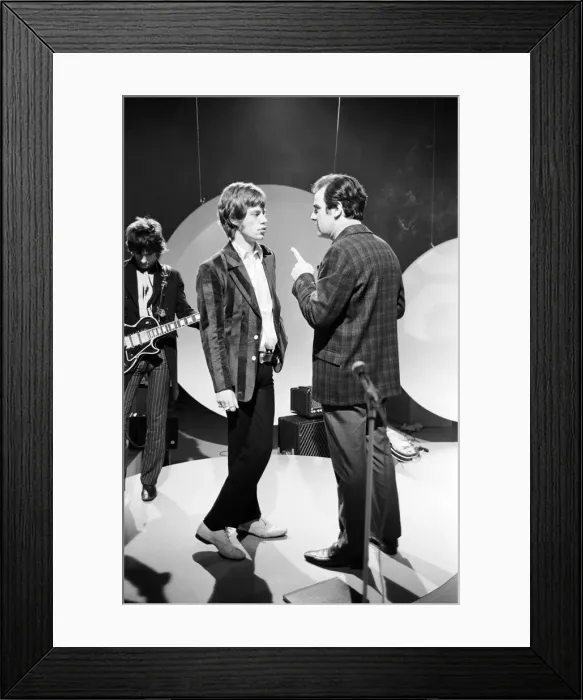 Framed Print : Mick Jagger talks to the TV director during rehearsals at Teddington for the Eamonn Framed Print : Mick Jagger talks to the TV director during rehearsals at Teddington for the Eamonn