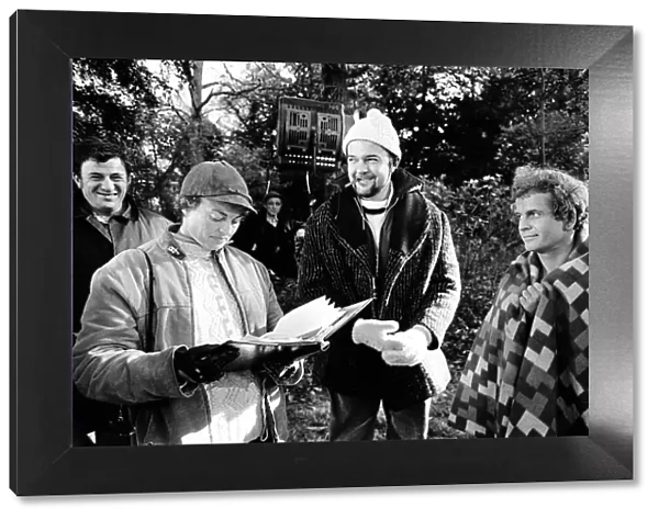 Peter Hall (centre) seen here with members of the film crew and Ian Holm (right