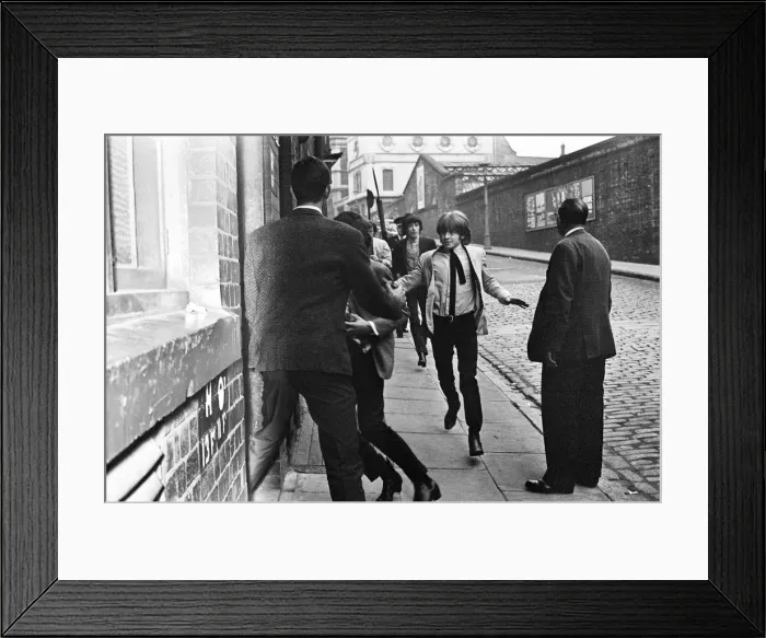 Framed Print : The Rolling Stones make a dash for the stage door while police keep the fans at bay Framed Print : The Rolling Stones make a dash for the stage door while police keep the fans at bay