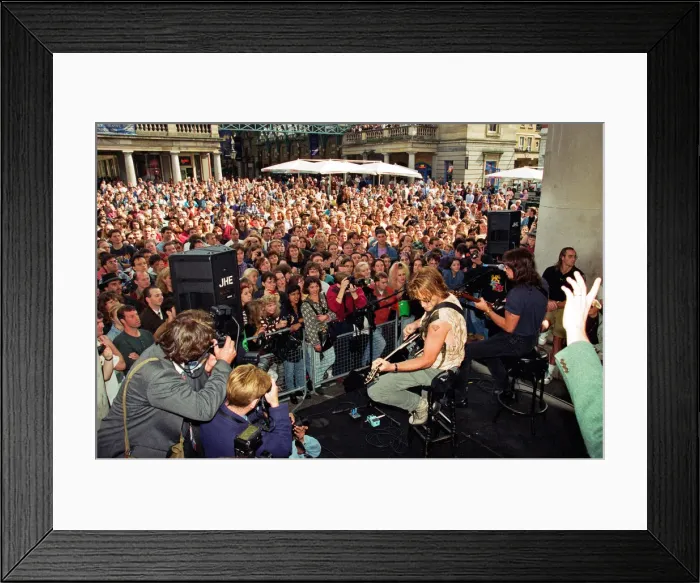 Framed Print : Jon Bon Jovi, lead singer of rock group Bon Jovi, busking in Covent Garden
