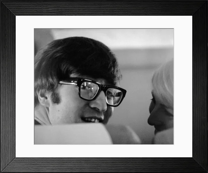 Framed Print : 7 February 1964 John Lennon with wife Cynthia on the aircraft to New York