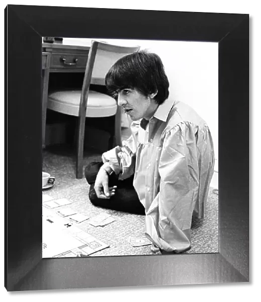 August 1964 George Harrison playing Monopoly at Bel Air home with Jackie De Shannon