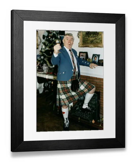 Framed Print : Andy Stewart singer holding goblet at home fireplace foot on fire christmass tree tartan Framed Print : Andy Stewart singer holding goblet at home fireplace foot on fire christmass tree tartan