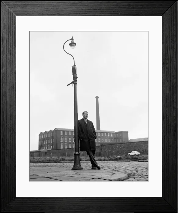 Framed Print : Blackburn Rovers forward John Byrom walking down the street where he lives Framed Print : Blackburn Rovers forward John Byrom walking down the street where he lives
