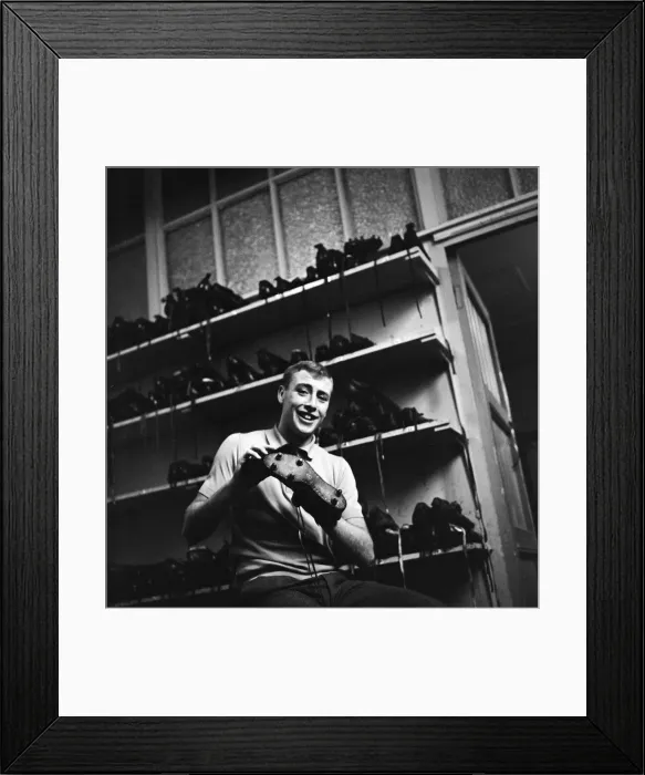 Framed Print : Blackburn Rovers forward John Byrom cleaning his football boots. December 1964