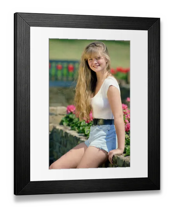 Framed Print : Eastenders actress Daniella Westbrook poses wearing aa white body top with denim shorts