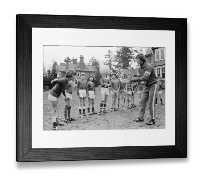 Framed Print : Queens Park Rangers footballer Don Masson coaching children to play football at the Our Framed Print : Queens Park Rangers footballer Don Masson coaching children to play football at the Our