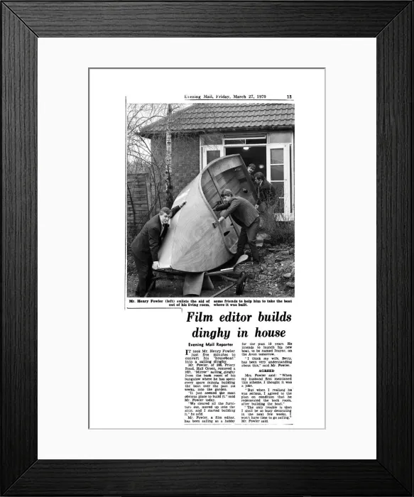 Framed Print : Mr Henry Fowler (left) enlists the aid of some friends to help him to take the boat out