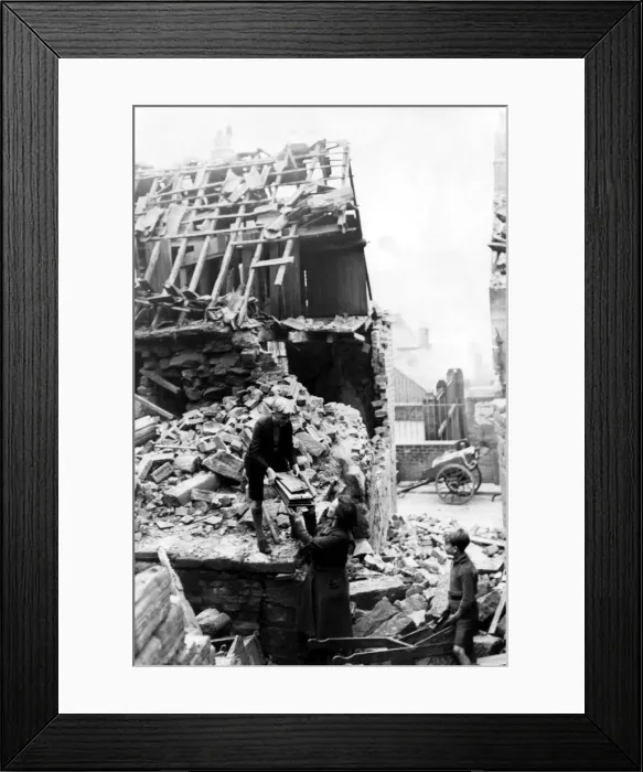 Framed Print : World War Two - Second World War - A family salvage some belongings from the debris of Framed Print : World War Two - Second World War - A family salvage some belongings from the debris of