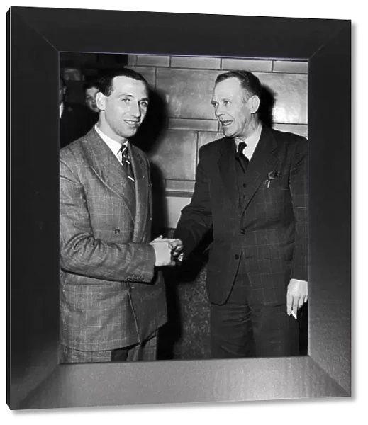 Footballer Tommy Lawton (left) shakes hands with his new manager Arthur Stollery after