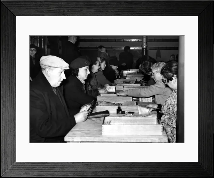 Framed Print : Post World War Two - Second World War - People exchange old ration books for new issues Framed Print : Post World War Two - Second World War - People exchange old ration books for new issues