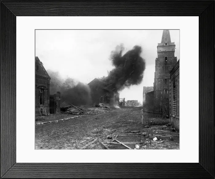 Framed Print : An explosion in a large house which had been fired by the Germans during preamble to