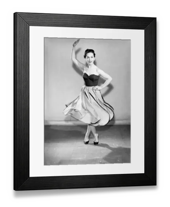 Framed Print : Clothing: Fashion: Skirt: Woman wearing leaf skirt. Model: Jackie Curtis. 1957 B480-001