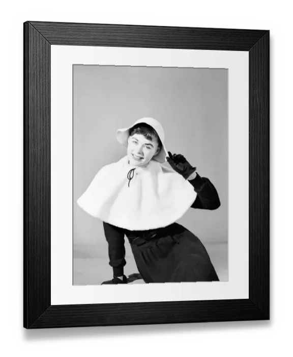 Framed Print : Clothing: Fashion: Hats: Woman wearing matching cape and hat. 1957 B261 Framed Print : Clothing: Fashion: Hats: Woman wearing matching cape and hat. 1957 B261