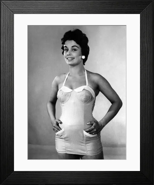 Framed Print : Clothing Fashion 1955. Woman modelling swimming costumes. P015133