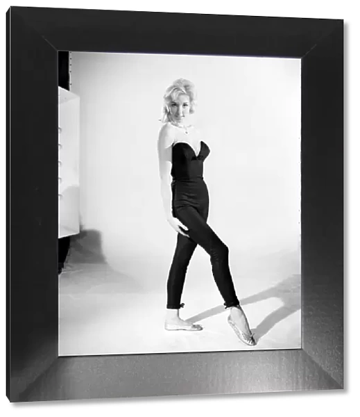 Clothing: Fashion: Tights: Woman wearing full length tights. 1960 B1296-002
