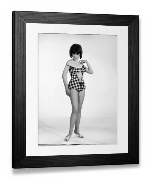 Framed Print : Clothing: Fashion: Beachwear. Woman wearing swimming costumes. Model: Debbie Attwood