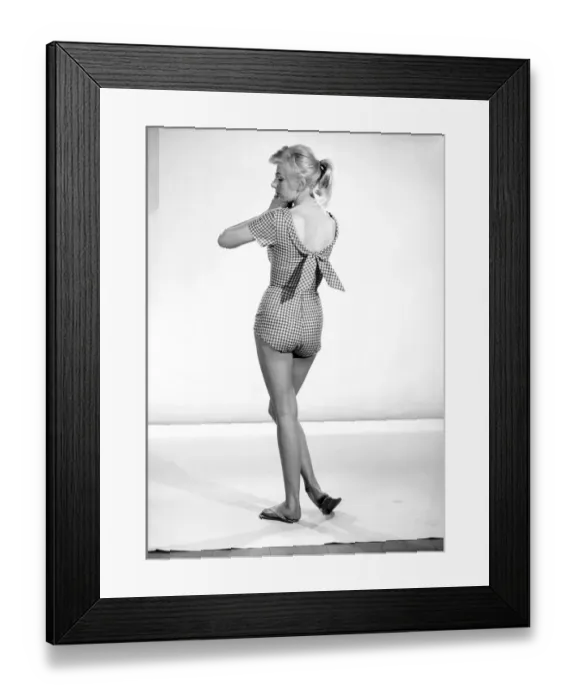 Framed Print : Clothing: Fashion: Beachwear: Woman wearing check swimming costume