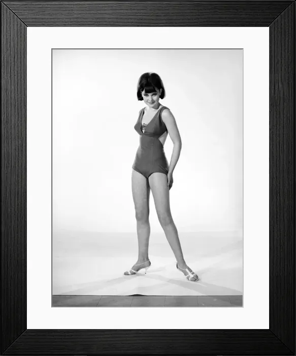 Framed Print : Clothing: Fashion: Beachwear. Woman wearing swimming costumes. Model: Debbie Attwood Framed Print : Clothing: Fashion: Beachwear. Woman wearing swimming costumes. Model: Debbie Attwood